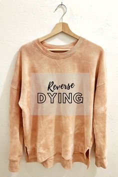 a sweatshirt with the words reverse dying printed on it