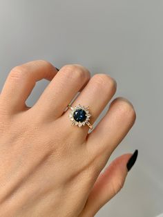 Gorgeous Vintage Inspired Peacock Sapphire Ring ✧ 14K Gold ✧ Accented with natural quartz diamonds This gorgeous, timeless ring features a stunning peacock sapphire and natural crystals. ✧ Gemstone: Sapphire ✧ Shape: Oval ✧ Center Gem size: 6.0 mm ✧ Total Carat Weight: 1.7 ct. (approx.) ✧ Gemstone Origin: Brazil ✧ Sizes 3.75-11.25 ✧ This ring set will arrive ready to gift in a Kherish Box. ✧ Due to the nature of the handmade process, each piece may slightly vary in color, size, shape, and contai Peacock Sapphire, Sun Birthday, Timeless Ring, Marquise Ring, Gold Filled Ring, Richmond Va, Sapphire Engagement, Birthday Gift For Her, Crystal Rings