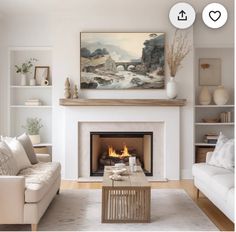 a living room filled with furniture and a fire place in front of a painting on the wall