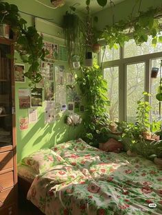 a bedroom with green walls and plants growing on the windowsills above the bed