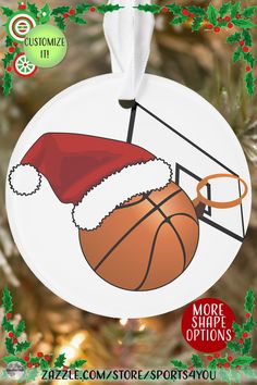 a christmas ornament with a basketball and santa's hat hanging from a tree