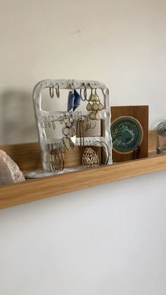 a shelf filled with jewelry and other items