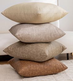 four pillows stacked on top of each other