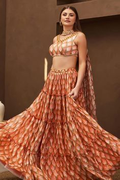 Orang layered lehenga with zari line work and all over tulip prints. Paired with a coordinating padded blouse with tribal embellished neckline and hem. Comes along with a choker dupatta with tulip prints and tribal motif work. - Aza Fashions Choker Dupatta, Layered Lehenga, Reception Sarees, Papa Don't Preach, Cape Lehenga, Haldi Dress, Kurta Lehenga, Lehenga Pattern, Peach Sorbet