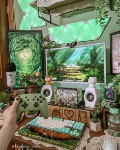 a person holding a game controller in front of a tv screen with an image on it