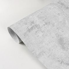 a white wallpaper with grey grungy textured paper on the bottom corner