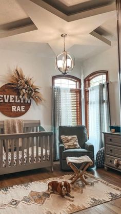 a baby's room with a crib, chair and rug