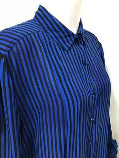 "Vintage black and blue striped blouse by  'The Bay'. Beautiful condition! 100% polyester, sized as a 16.  Measures 17\" across shoulder, 22\" pit to pit, 29\" long." Cheap Retro Blue Blouse, Blue Vertical Stripes Button-up Blouse, Blue Vertical Striped Shirt For Work, Blue Vertical Stripe Shirt For Work, Blue Striped Shirt For Work, Blue Vertical Striped Collared Top, Blue Workwear Top With Striped Collar, Blue Vertical Stripes Top For Formal Occasions, Blue Vertical Stripes Formal Tops