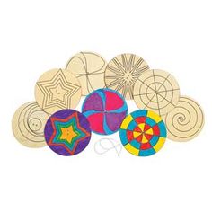 a pile of wooden circles with different designs on them