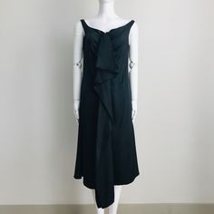 Simple, Elegant And Sophisticated Sleeveless Dress With A Vintage Flair. Wide Scoop Neckline. Zip Front With Hook And Eye Closure. Cascading Ruffles On Front. A-Line Silhouette. Unlined. Made In Italy. Color: Black. Fabric: 100% Silk. Size: It 44 / Us 8. Measurement When Garment Laid Flat Approximately - Bust: 18”, Waist: 17”, Hips: 20”, Length: 42” (50”Including The Front Ruffle). Nwt (Store Tag Only, No Original Hangtag). Never Worn. Store Handled. Can Provide More Info And Pictures. Pre-draped Sleeveless Evening Dress With Ruffles, Pre-draped Sleeveless Dress With Ruffles, Pre-draped Sleeveless Dress For Dinner, Elegant Evening Sleeveless Dress With Asymmetrical Neckline, Elegant Sleeveless Dress With Asymmetrical Neckline For Evening, Elegant Draped Sleeveless Formal Dress, Elegant Draped Sleeveless Cocktail Dress, Elegant Draped Sleeveless Dress For Evening, Sleeveless Ruffled Pre-draped Evening Dress