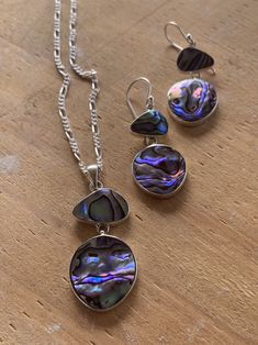 Modern design abalone earrings and necklace set, abalone set in sterling silver on 16 inch sterling silver chain. Made in Bali. A gorgeous set! The pendant hangs 1.5 inches and is 3/4 inch at its widest. The earrings hang 1.25 inches and are 5/8 inch wide at their widest. Price is for the set but if you want only the necklace or the earrings, message me. These would make a lovely engagement gift, graduation gift, birthday gift or something just special for yourself. High Luster Silver Dangle Jewelry, High Luster Sterling Silver Jewelry In Silver, High Luster Sterling Silver Jewelry, Unique Silver Jewelry With High Luster, Unique High Luster Silver Jewelry, Sterling Silver High Luster Jewelry Gift, Handmade Silver Jewelry With Mother Of Pearl, High Luster Teardrop Sterling Silver Jewelry, Silver Mother Of Pearl Jewelry For Gift