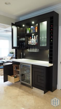 a modern home bar with wine glasses on the shelves