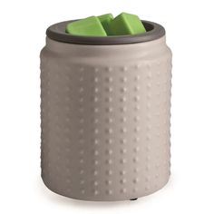 a gray canister with green cubes in the top and bottom, on a white background