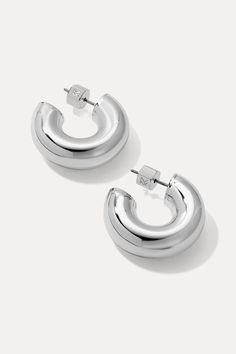 With a chunky silhouette and a rounded shape, the Drew Huggies are the epitome vintage chic charm. An elegant and stylish pair for everyday wear, you’ll love how well they can transition from casual day looks to date night ensembles. Sterling silver-plated brass 25mm diameter, 7mm thick Chic Silver Jewelry For Work, Chic Silver Jewelry For Workwear, Modern Silver Jewelry For Spring, Chic Silver Earrings For Spring, Chic Silver Jewelry With Shiny Finish, Silver Round Huggie Earrings With Polished Finish, Modern Sterling Silver Huggie Earrings With Shiny Finish, Modern Nickel-free Drop Huggie Earrings, Silver Stainless Steel Tarnish-resistant Huggie Earrings