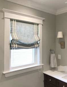 a bathroom with a sink and window in it