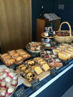 various pastries and desserts on display at a bakery