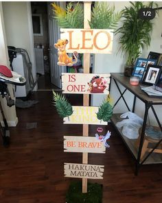 a wooden sign that says leo is one, the lion king and the little prince