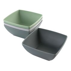 two grey and green bowls sitting next to each other