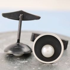 An ideal gift for the Groom or a 30th wedding anniversary gift for your husband, these pearl anniversary cufflinks for men are inspired by Art Deco design. Geometric cufflinks with strong contrasts reminiscent of 1920's design, these Art Deco cufflinks are a classic design that that will last a lifetime, the perfect pair of formal cufflinks for men. Handmade cufflinks are a speciality at Louy Magroos, Laura designs and makes all her custom cufflinks in her workshop, using traditional silversmith Modern Pearl Jewelry, Gatsby Style Wedding, Gift For The Groom, 1920s Design, 30th Anniversary Gifts, Pearl Anniversary, Handmade Cufflinks, Thoughtful Gifts For Him, Pearl Cufflinks