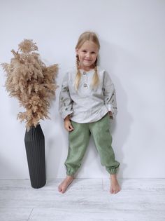 Gender neutral long sleeve linen shirt and joggers. It is a comfortable and eco-friendly garment for your children.  Each product I make by hand with maximum attention to detail. I use only natural linen and coconut buttons. The sleeves of the shirt are decorated with hand print.  It is a free model in boho style. A child can wear this shirt happily for several seasons. I sew clothes for children with love and I believe that these clothes will also be loved by children.  Unique and absolutely un Clothes Summer, Organic Baby Clothes, Baby Outfit, Green Pants, Baby Outfits, Unique Things, Boho Stil, Shirt And Pants, Organic Baby