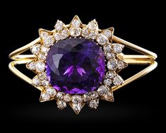 Amethyst and Diamond Bangle Bracelet, 50.00 Carats~ Weighing approximately 50 carats, the cushion-cut amethyst at the center of this bangle bracelet exhibits the deep, evenly distributed purple color found in only the finest examples. Creating a starburst motif around the amethyst are approximately 5 carats of diamonds. 18K yellow gold. ~M.S. Rau Golconda Diamond, Statement Bracelets, Diamond Bangle Bracelet, Amethyst And Diamond Ring, Amethyst Healing, Jewelry For Sale, Diamond Bangles Bracelet, Brace Yourself, Amethyst Jewelry