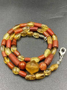 Ancient crystals and Agate jasper beads necklace from my old collections The necklace is the combination of old agate jasper and yellow color crystals rock beads which found in India but this kind of beads mostly found in central Asia countries as well they were used to be a protective beads very good condition and beautiful agate jasper 10 pictures available which you can swipe to see the details of this beautiful necklace we provide fast and free shipping service world wide Amber Gemstone Beads, Vintage Amber Beaded Necklaces With Natural Stones, Amber Gemstone Beads For Gift, Amber Oval Beads Gemstone Necklace, Amber Beaded Necklaces With Natural Stones For Healing, Amber Necklace With Oval Gemstone Beads, Amber Natural Stones Beads For Jewelry Making, Artisan Amber Beaded Necklaces With Natural Stones, Amber Artisan Beaded Necklace With Natural Stones