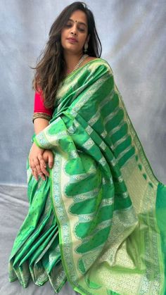 Inspired by ancient Mughal architecture, this beautiful dual tone  mashru silk saree has intricate gold zari weaving in mehrab pattern and has small buttis in blue contrast colour all over the body. Blouse: parrot green mashru silk material [Unstitched] please send us a message if you want blouse material separated  and pico done  ( no extra charge) Festive Green Paithani Silk Pre-draped Saree, Green Dola Silk Pre-draped Saree For Diwali, Festive Green Pre-draped Saree With Zari Weaving, Green Cutdana Traditional Wear For Eid, Green Paithani Silk Pre-draped Saree With Self Design, Green Pre-draped Saree With Self Design For Diwali, Pista Green Paithani Silk Saree, Bollywood Style Pista Green Paithani Silk Saree, Pista Green Bollywood Paithani Silk Saree