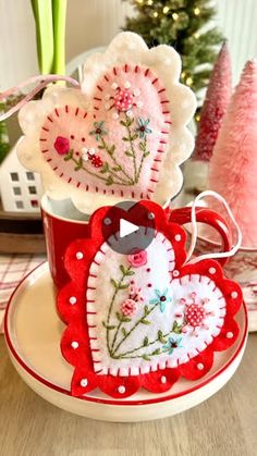 32K views · 5.2K reactions | “Cute as a Button Felt Valentine Ornament” pattern available today 1/2/25 thru 1/4/25 on sale for $4.99  in my Etsy shop. It’s linked in my linktree below my bio.

This mini tutorial shows how you can make these adorable little embroidered felt hearts ♥️
- in this tutorial I am showing how I embroidered the design using a product called Stick n Stitch. You can purchase this on Amazon. Run it through your printer, cut out and peel off the back. Stick to your project and then stitch. Once you’re done, you rinse under warm water to dissolve all of the fibers. It’s pretty slick!
- if you don’t want to bother with the wash away stabelizer method, go old school and use a light box, lit computer screen or daytime window and trace the image onto the felt with a heat er