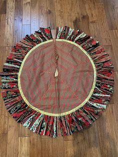 a round piece of cloth sitting on top of a wooden floor