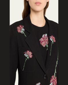 Libertine "Cecil Beaton" maxi coat features pink carnation embellished details throughout     Notched collar     Button closure     Long sleeves    Front patch pockets     Full length    Relaxed fit    Wool    Lining: Polyester    Dry clean    Made in USA Spring Embroidered Notch Lapel Blazer, Fall Embellished Outerwear With Notch Lapel, Chic Long Sleeve Blazer With Floral Embroidery, Tailored Floral Embroidered Blazer For Spring, Embellished Outerwear For Work, Embroidered Notch Lapel Blazer For Work, Elegant Floral Embroidered Outerwear For Work, Workwear Embroidered Blazer With Notch Lapel, Tailored Embellished Outerwear For Work