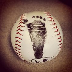 a baseball with a hand print on it