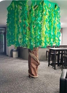 there is a tree made out of green paper