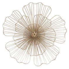 a gold metal flower decoration on a white background