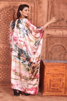 This beautiful long silk Kaftan. The graceful colour in background beautifully complements the bright to bring out the best in you. Dress up to shine with a messy hair bun, copper accessories and wedges. The round neckline adds a dash of glamour to the attire. An ideal pick to go on a brunch party or an easy afternoon with your girls. Let that stylish look you always dreamt of, come alive with this Kaftan. One size fits all (Free size)FABRIC •Silky satin ( The fabric is totally soft, cool, not s Multicolor Bohemian Maxi Dress For Navratri, Navratri Silk Dress With Digital Print, Festive Printed Dresses With Kimono Sleeves, Festive Printed Dress With Kimono Sleeves, Printed Silk Long Maxi Dress, Silk Floor-length Dupatta With Digital Print, Long Multicolor Kimono For Festivals, Multicolor Maxi Dress With Dabka Detail, Flowy Silk Maxi Length Kimono