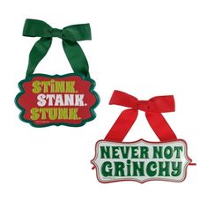 two signs with bows on them that say stink stank stink never not gringy