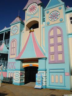 a large building painted in pastel blue and pink