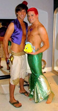 two men dressed up as the little mermaid and prince nauva pose for a photo