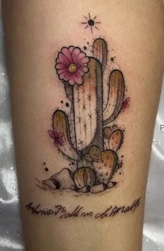 a tattoo with a cactus and flowers on it