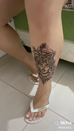 a woman with a tattoo on her leg