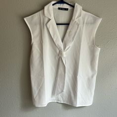 Never Worn! Size Medium 100% Polyester Spring V-neck Office Wear Tops, White V-neck Top For Office, White Summer Office Wear Top, White Summer Tops For Office Wear, Sleeveless Summer Office Tops, Sleeveless Summer Top For Office Wear, White Sleeveless Office Blouse, White Sleeveless Blouse For Office, White Sleeveless Blouse For Formal Occasions