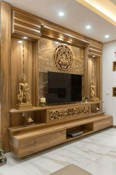 a living room filled with furniture and a flat screen tv on top of a wooden entertainment center