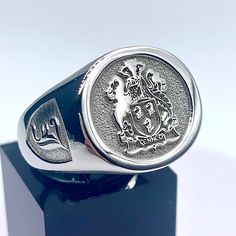 A silver signet ring with the Kennedy family crest and an Old English 'J' initial on the side Wax Seal Ring, Family Crest Rings, Custom Wax Seal, Heritage Jewellery, Timeless Symbol, Arm Jewelry, Silver Signet Ring, Silver Coat, Wax Seal Stamp