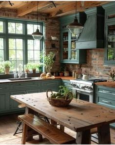 a kitchen filled with lots of green cabinets and counter tops next to a wooden table