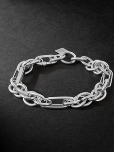 Classic jewellery often serves as a starting point for Lauren Rubinski, which she personalises and modernises through her unique design. This bracelet is cast from white gold using a variety of chain links, creating contrasting shapes and dimensions. It's understated enough to make your everyday signature. Modern Sterling Silver Bracelet With Chunky Chain, White Gold Chunky Link Chain Bracelet, White Gold Chunky Chain Link Bracelet, White Gold Link Chain Bracelet With Chunky Chain, Sterling Silver Bracelets With Chunky Chain In Oval Link, Elegant White Gold Bracelet With Chunky Chain, Modern Sterling Silver Chunky Chain Bracelet, Luxury Chunky Chain Link Bracelet, Modern Silver Chain Link Jewelry