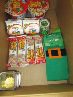 an open box with snacks and candy in it