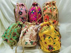 "Lot Of 100 Indian Handmade Women's Embroidered Clutch Purse Potli Bag Pouch Drawstring Bag Wedding Favor Return Gift For Guests Free Ship. PRODUCT DETAIL :- -------------------------- Product Item : Embroidered Potli Bags with Pearl Strap Size : 6x8\" inches approx Product Line: Rajasthani Ethnic Women Handbag Potli Bags Material -: Fabrics, Beads Occasion: Any Occasion, Festive, Party, Wedding, Bridal PRODUCT DESCRIPTION :- This colorful Clutch Purse with vibrant colors & ethnically design Multicolor Handwork Pouch For Festivals, Multicolor Handwork Bags For Celebration, Festive Multicolor Bag With Floral Embroidery, Multicolor Festive Bag With Floral Embroidery, Festive Multicolor Floral Embroidered Bag, Multicolor Handwork Pouch For Celebration, Celebration Multicolor Handwork Pouch, Embroidered Multicolor Potli Bag For Festivals, Multicolor Embroidered Potli Bag For Festivals