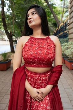 Red attached cancan lehenga with all over floral print. Paired with a padded blouse with placed hand embroidery and dupatta with mirror work hand embroidery. - Aza Fashions Sleeveless Art Silk Traditional Wear For Wedding, Sleeveless Red Lehenga For Wedding, Semi-stitched Sleeveless Wedding Sets, Sleeveless Lehenga With Unstitched Blouse For Wedding, Red Sleeveless Lehenga For Weddings, Red Sleeveless Bollywood Style Sets, Red Sleeveless Bollywood Set, Red Designer Wear Choli, Red Sleeveless Zari Work Set