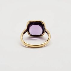 PURPLE PARADISE WHAT IT IS: 18k yellow gold ring with amethyst 9.5 cts WHY IT’S SPECIAL: Exquisite in its design, this ring elevates the concept of simplicity and sophistication to the highest level. Surrounding the finger is an 18k yellow gold band, with a mesmerizing cushion-cut amethyst at its heart. Truly enchanting... GOOD TO KNOW: 18k yellow gold 3.05 gmsAmethyst 9.5 ctsRing Size: 7 WHY WE LOVE DORIAN WEBB: We can't take our eyes off Dorian Webb's purposeful creations that honor women, emb Luxury Purple Ring With Bezel Setting, Luxury 14k Gold Purple Rings, Luxury Purple 14k Gold Rings, Elegant Yellow Gold Amethyst Open Ring, Timeless Purple 14k Gold Rings, Elegant Cushion Cut Yellow Gold Amethyst Ring, Luxury Gold Amethyst Ring With Bezel Setting, Luxury Yellow Gold Amethyst Ring With Bezel Setting, Timeless Gold Amethyst Ring