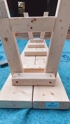 a piece of wood that has been made to look like a ladder on the ground