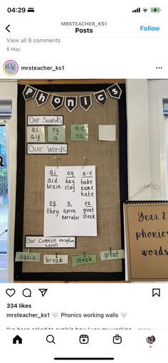 a bulletin board with words on it and pictures taped to the wall behind it,